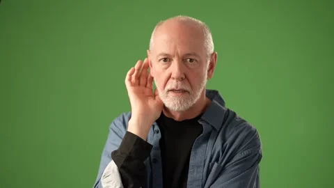 Senior Man Expressing Emotion in Front of a Green Screen Backdrop Stock Footage 305570216