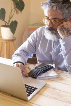 Senior man facing financial problems checking online finances 스톡 사진