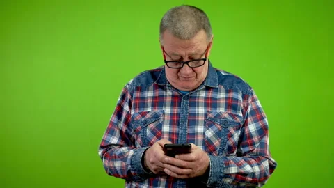 Senior man with fingers fast texting message chatting on his smartphone. Stock Footage 260787431