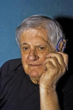 Senior man with glasses Dramatic side portrait of a senior man with a pair... Stock Photos