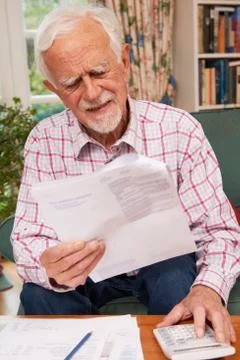 Senior Man Going Through Finances Looking Worried Stock Photos