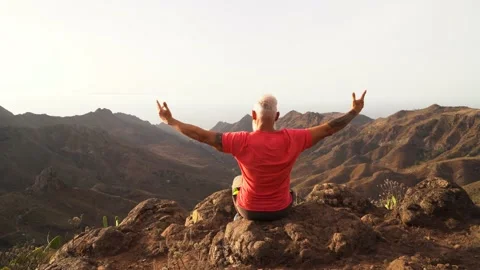 Senior man greeting sunset Stock Footage 139871852
