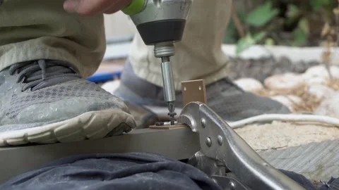 Senior man hands drilling a screw with electric drill close up work at home Stock Footage 170724940
