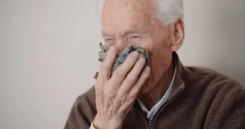 Senior man has cold snot and sneezing Stock Footage 126646915