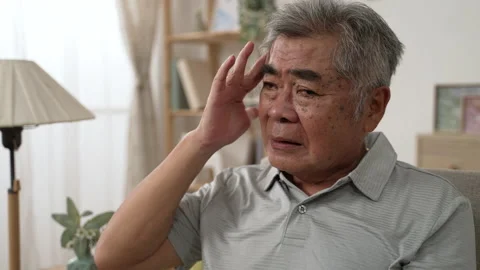 Senior man having headache with hands massage Stock Footage 165756045
