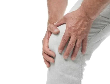Senior man having knee problems on white background, closeup Stock Photos