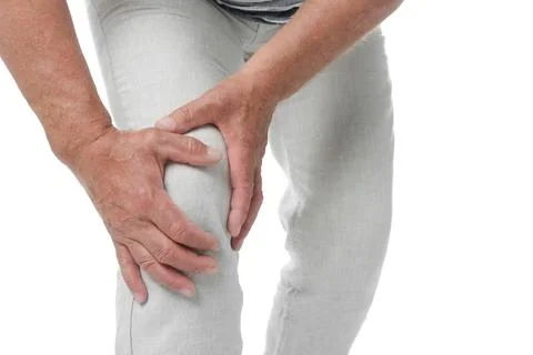 Senior man having knee problems on white background, closeup Stock Photos