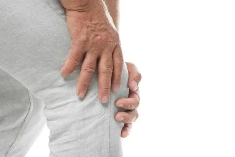 Senior man having knee problems on white background, closeup Stock Photos
