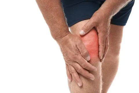 Senior man having knee problems on white background, closeup Stock Photos
