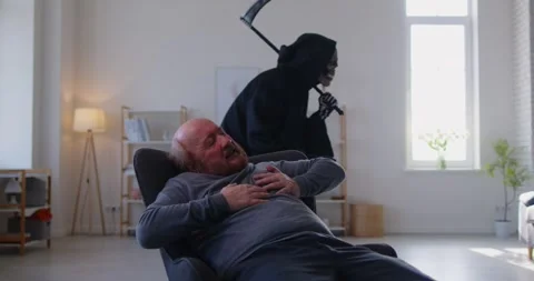 Senior man with heart attack feeling proximity of death while grim reaper Stock Footage 308283997