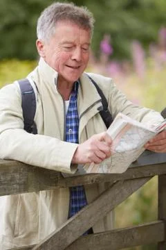 Senior Man Hiking In Countryside Stock Photos