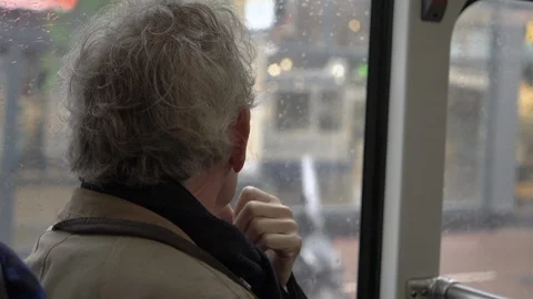 Senior man on his way to museum district in Amsterdam by tram Stock Footage