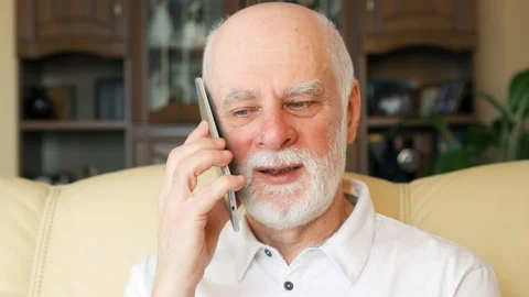 Senior man at home using cellphone. Professor talking on mobile. Active modern Stock-Footage 85986215