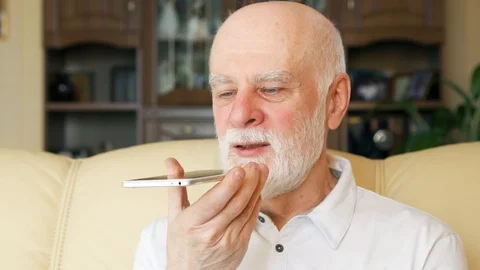 Senior man at home using cellphone. Professor talking on mobile. Active modern Stock Footage 87420284