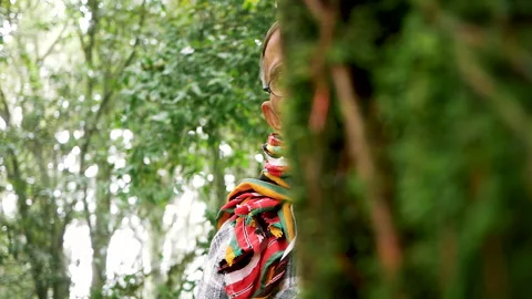 Senior man hugging old tree gently with smile in the forest. Nature protection Stock Footage 138334519
