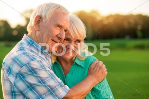 Senior man hugging woman. Stock Photos