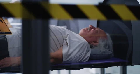 Senior man in hyperbaric chamber reassuring doctors Stock Footage 151632416