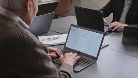 Senior Man Inputting Text in Computer Literacy Class Stock Footage 333703653
