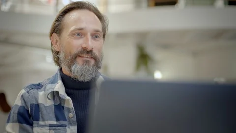 Senior man learns technology from laptop Stock Footage 121582481