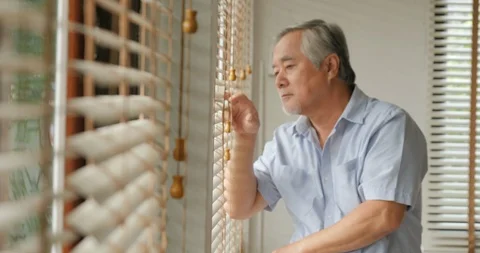 Senior man looking to outside with boring emotion. Stock Footage 95362885