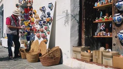 Senior man looking at pottery Stock Footage 140472818