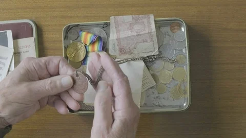 Senior man looking through a memory box Video stock 102292019