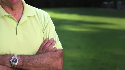 Senior man looks at camera and smiles. Medium shot. Stock Footage 33870943