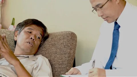 The senior man lying on sofa talking to his therapist Stock Footage 83292533