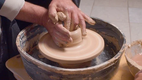 Senior man making a pot on a potter's wheel 스톡 동영상 112563686