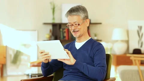 Senior man operating a tablet PC Stock Footage 159872695