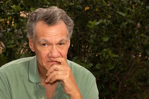 Senior man outside in deep thought Foto stock