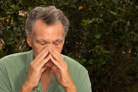 Senior man outside in deep thought Stock Photos
