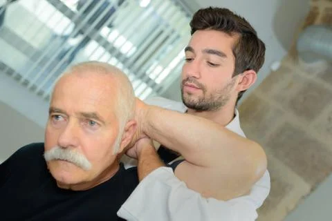 Senior man on a physiotherapy session Stock Photos