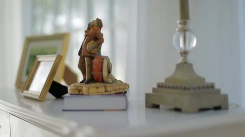 Senior man picking up an old framed photograph. 스톡 동영상 88342591