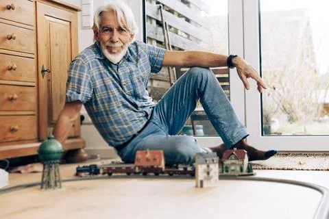 Senior Man Playing With Model Train Stock Photos