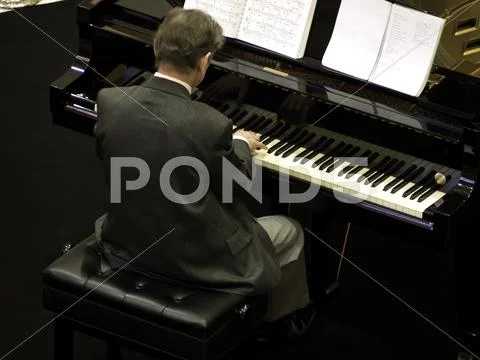 Senior Man Playing The Piano