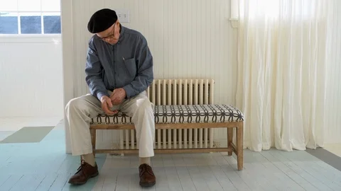 Senior man preparing to leave the house. Видео 88371178