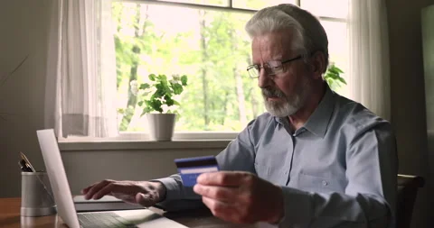 Senior man purchasing online feels indignant by credit card declined Stock Footage 141515462