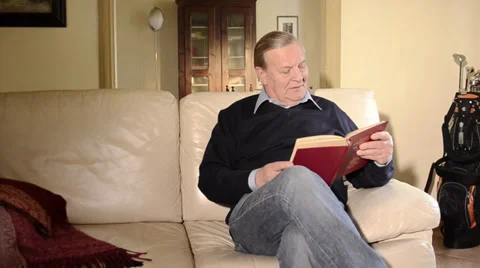 Senior man reading a book Видео 28129246
