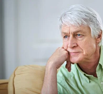Senior man, reflection and sofa in home with ideas, memory and thinking with Stock Photos