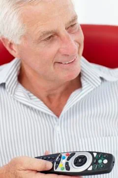 Senior man with remote control Stock Photos