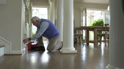 Senior man repairing a socket 動画素材 83394694