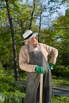 A senior man resting while doing gardening Stock Photos
