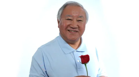 Senior man with rose Stock Footage 61663759