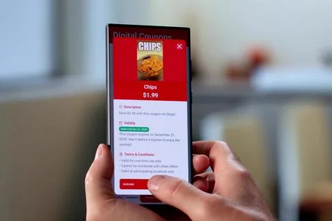 Senior Man Saving Money By Using Smartphone For Online Coupons. Stock Photos