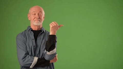 Senior Man Showcasing Emotion With Hand Gesture Against Green Screen Backdrop Stock Footage 305523339