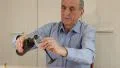 Senior man sits at a table and drinks wine HD Footage