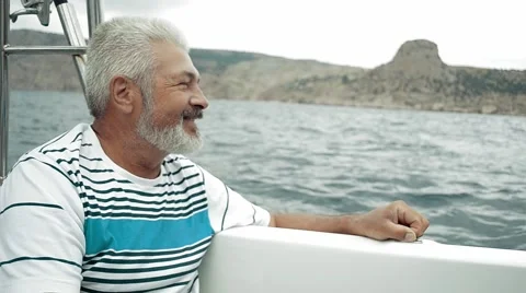 Senior Man Sitting On Boat Looking To The Sea Stock Footage 54950853
