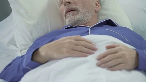 Senior man sleeping in bed and snoring loudly, problems with sleep, apnea Stock Footage 78639041