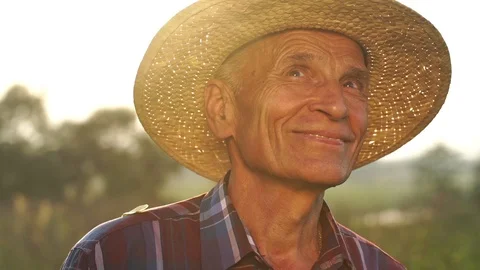 Senior man smiles looking around country slow motion Stock Footage 119596643